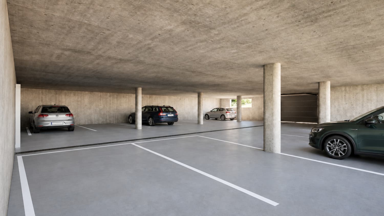 Einstellhalle unter den Mehrfamilienhäusern des Mondhaus Mountain Village in Fiesch mit zwölf Parkplätzen und Liftzugang zu den Ferienwohnungen